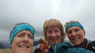 The relay baton of Nutmeg the squirrel (+ tracker) handed over on An Socach summit from Vicky and Heather.